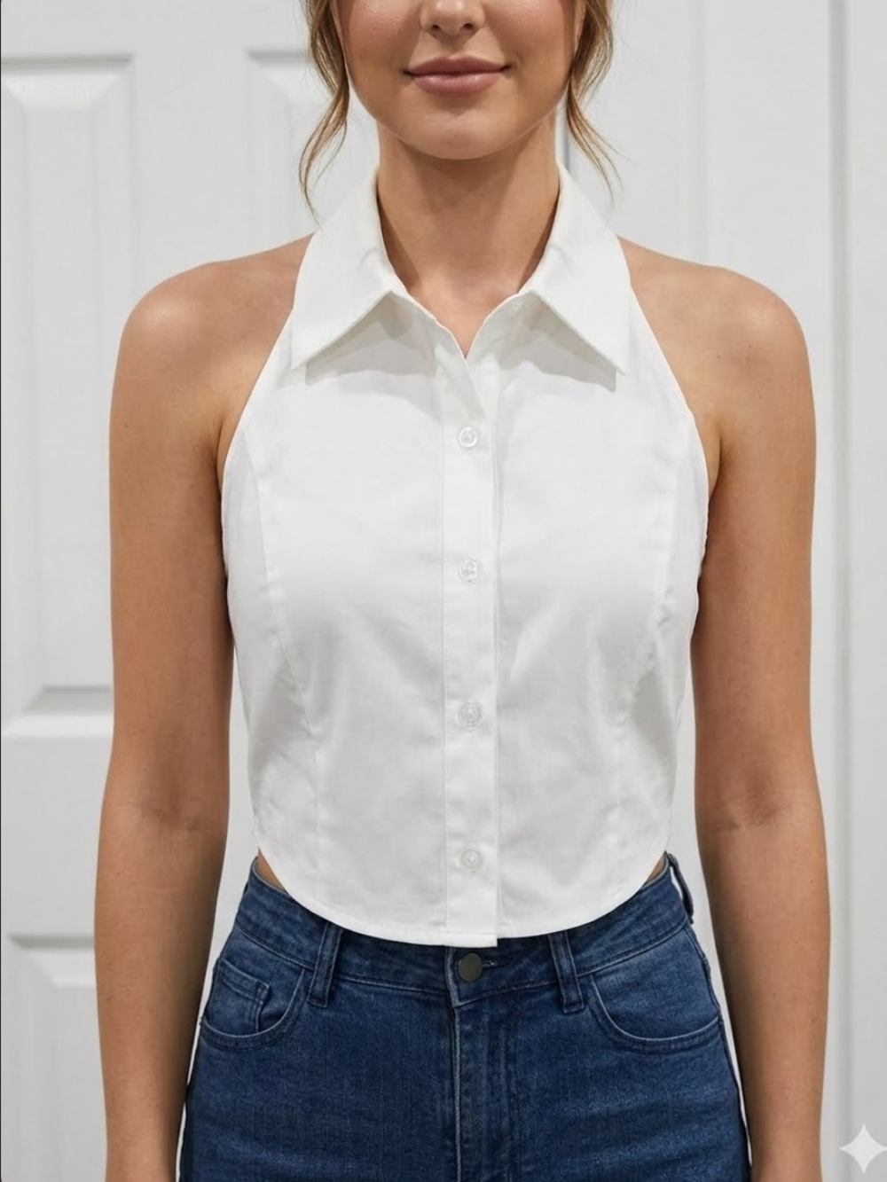 This Blue Blush halter-style blouse features a button-front shirt collar design.